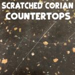 scratched counter with text overlay reading scratched corian counterotps