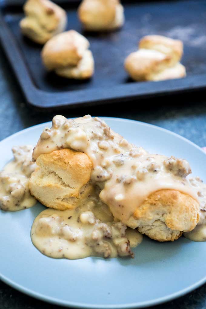 gray plate with biscuits and gravy 