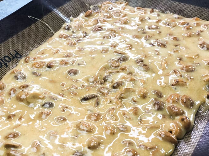 microwave peanut brittle spread on baking tray before cooling