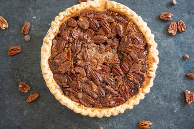 Chocolate Pecan Pie on slate counter with pecan halves