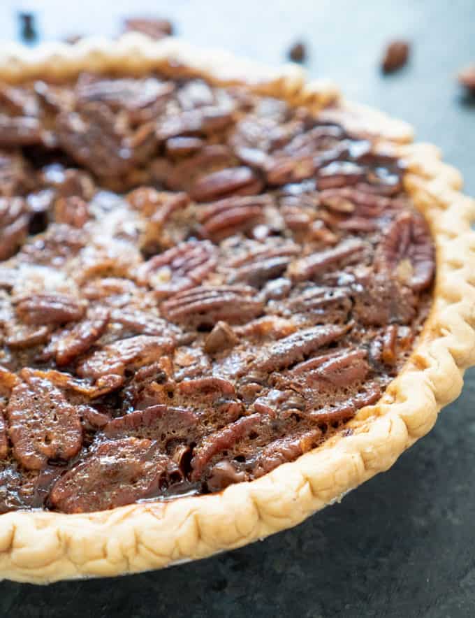 Chocolate Pecan Pie on dark countertop