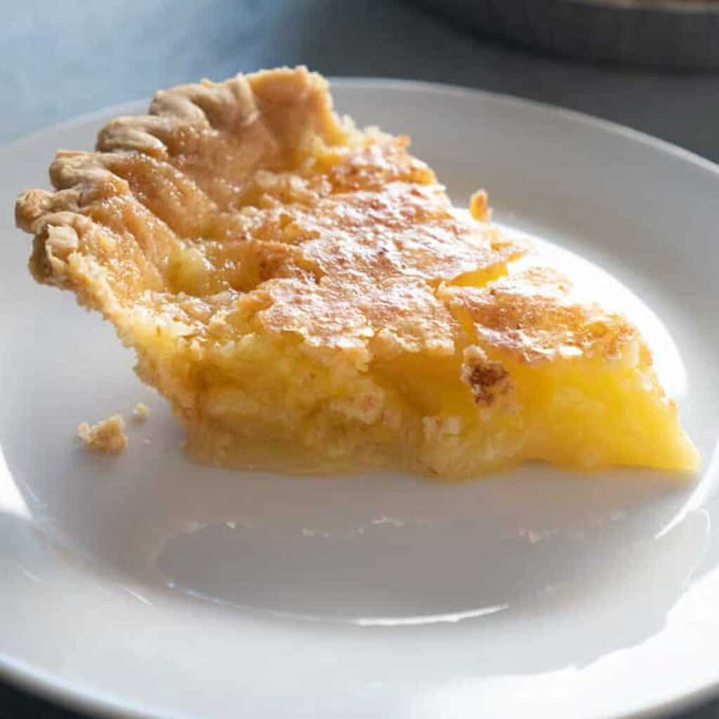 slice of coconut pie on white plate