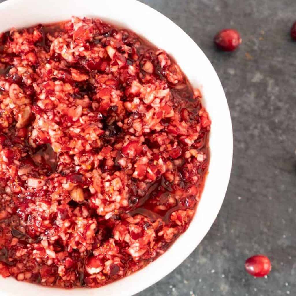 overhead view of cranberry relish in white bowl