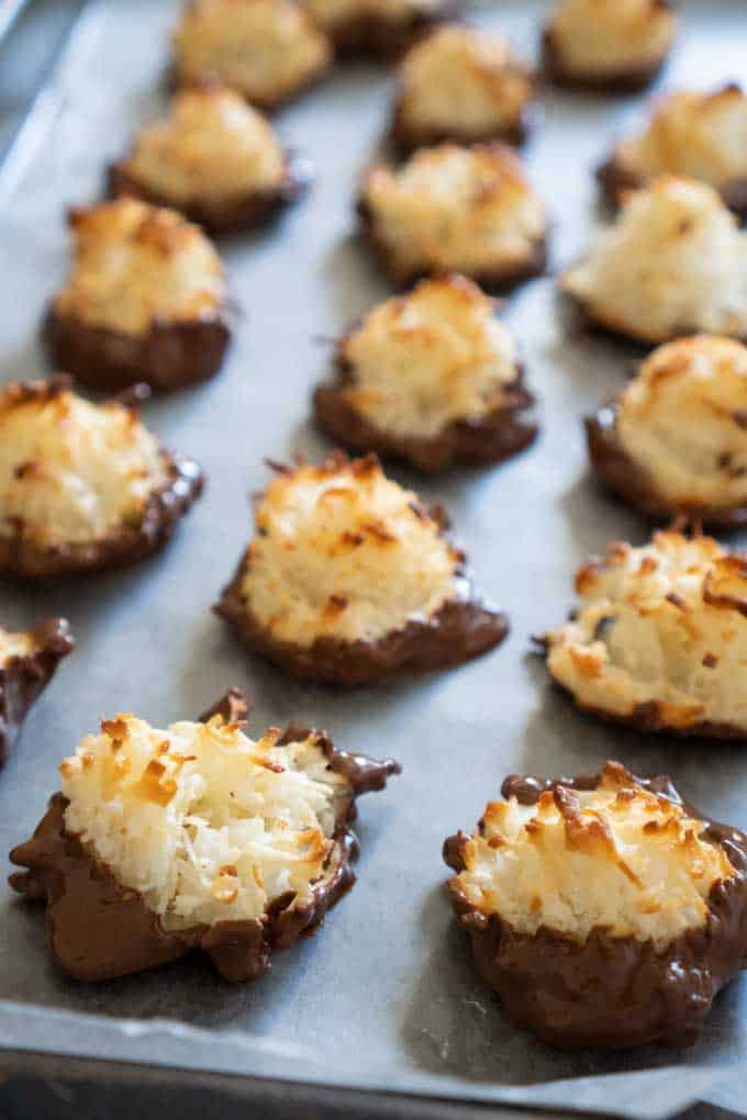 close up of coconut macaroons on parchment paper