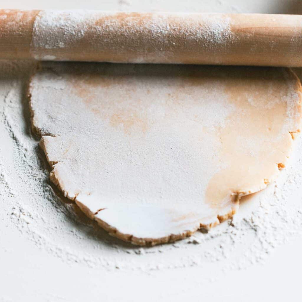 rolling out pie crust dough
