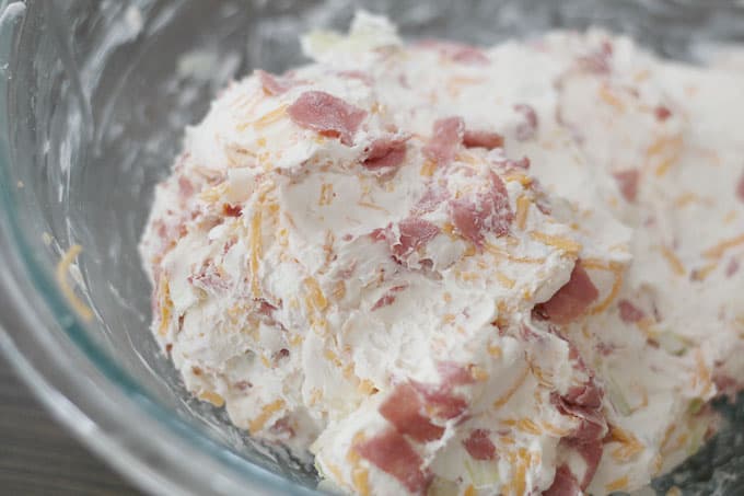 cheeseball ingredients after mixing in glass bowl