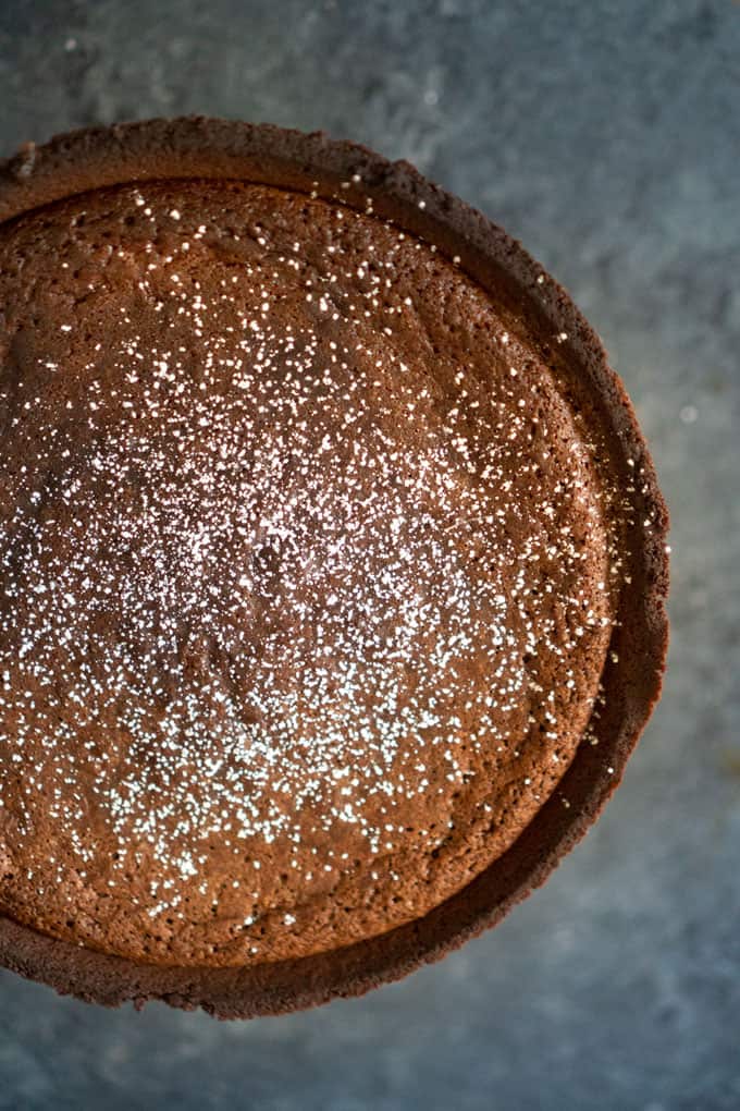 overhead view of hot fudge pie dusted with powdered sugar