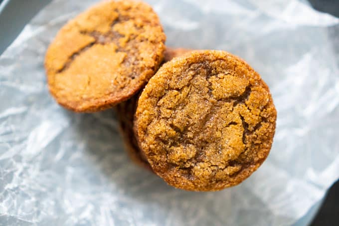 stack of Homemade Gingersnaps on parchment paper