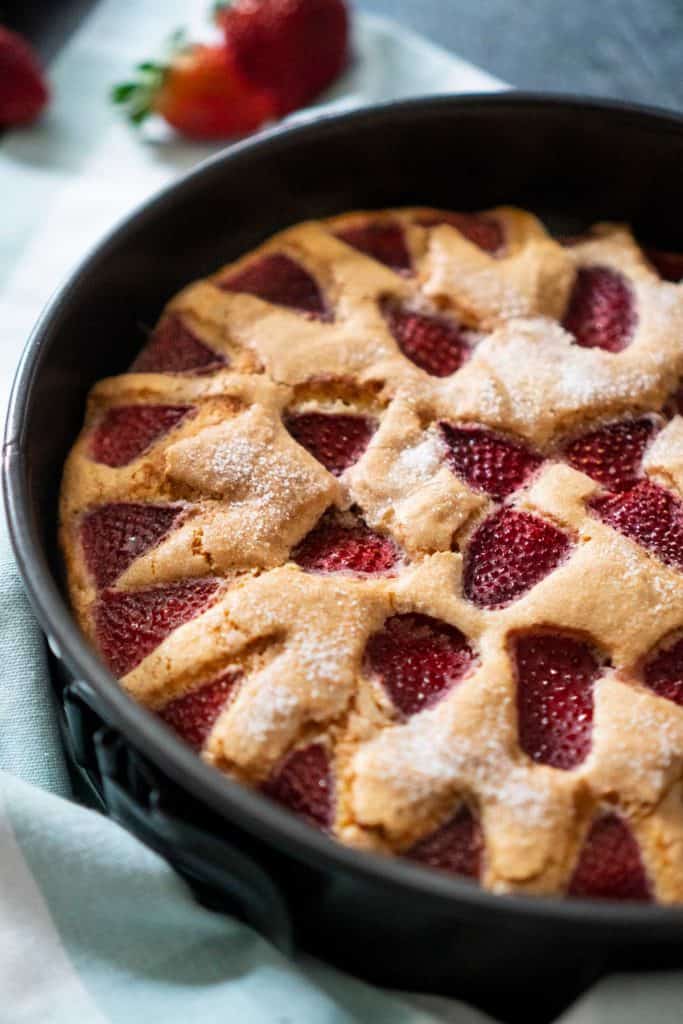 strawberry cake in dark pan