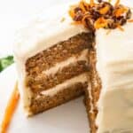 layered carrot cake with slice removed
