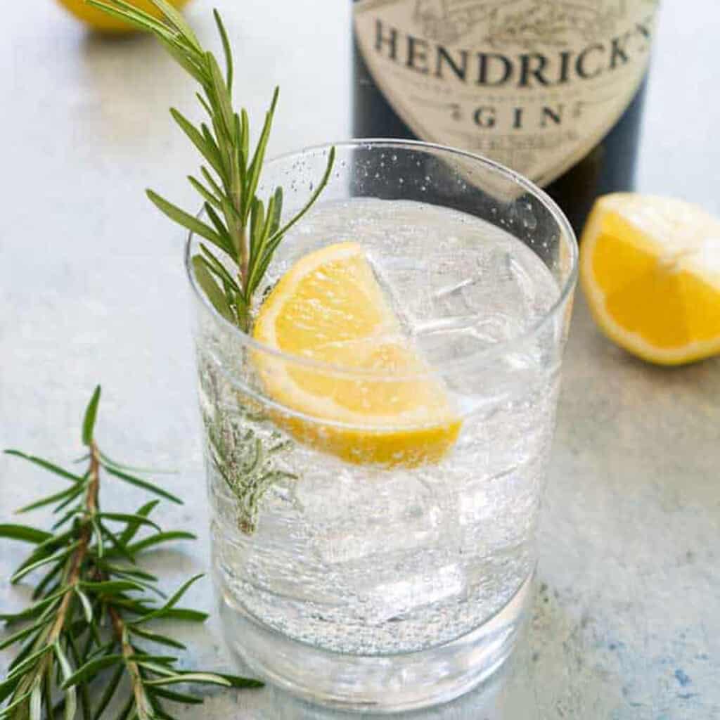 rosemary gin fizz in rocks glass