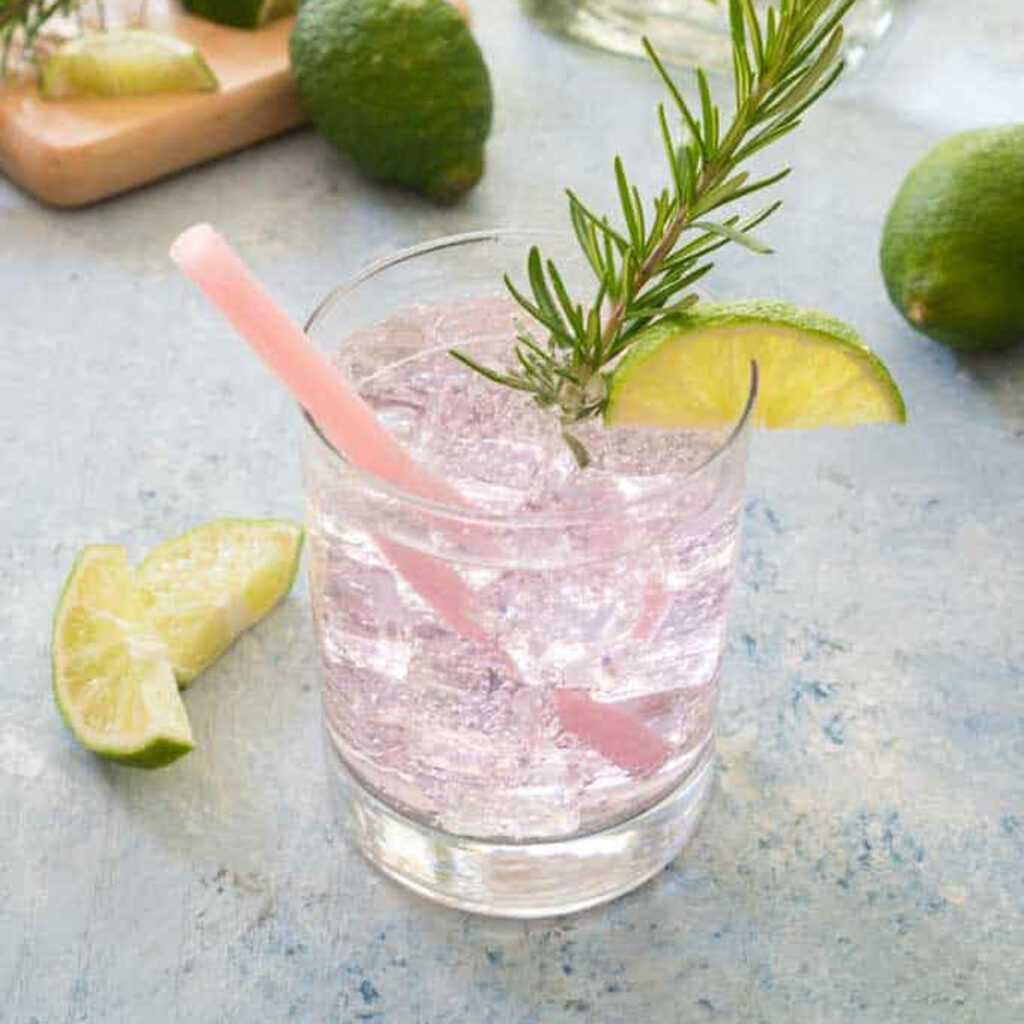paloma cocktail with soda water and pink straw