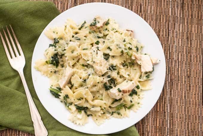 chicken florentine on white plate and placemat