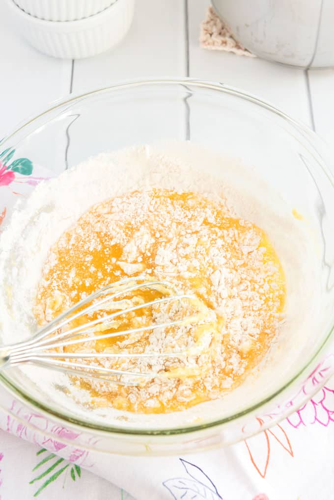 whisk stirring butter and flour in glass bowl