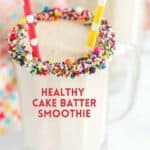 cake batter smoothie in glass with sprinkles on rim