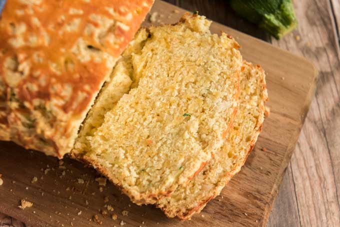 cheese zucchini bread sliced on cutting board