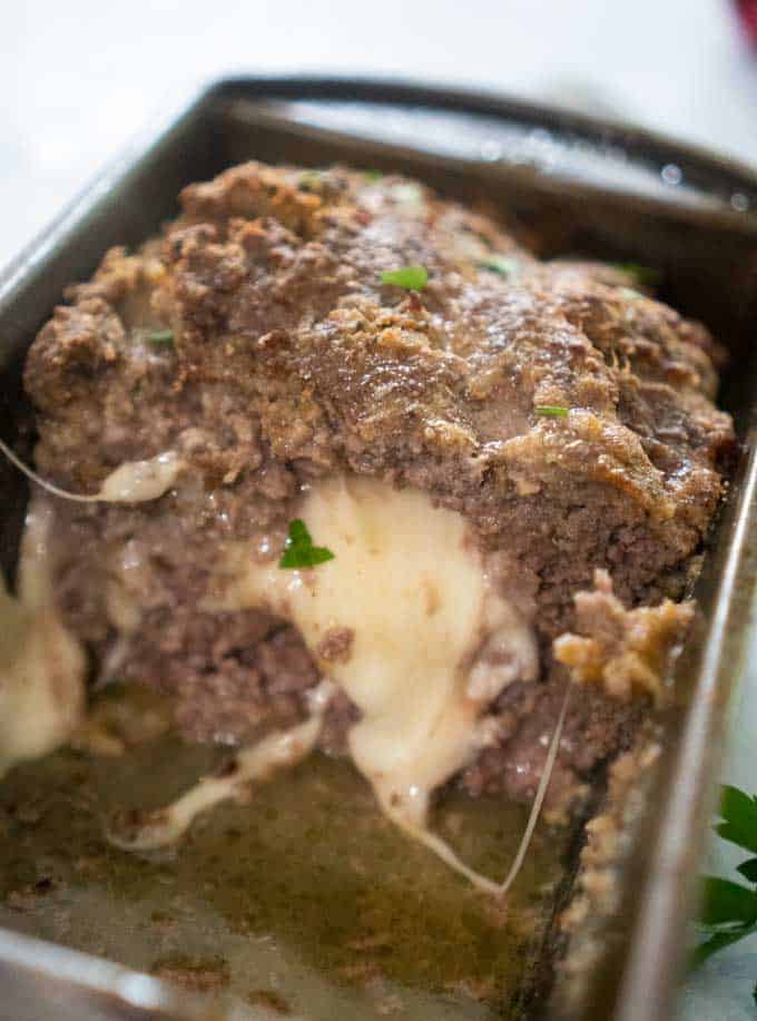 cheese stuffed meatloaf in a loaf pan
