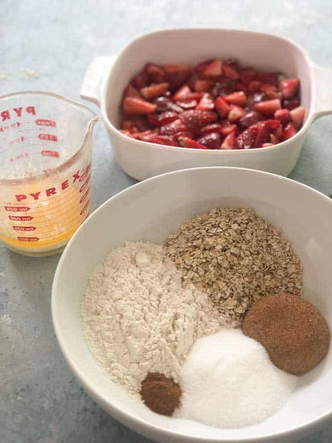 strawberry crisp ingredients in white bowl