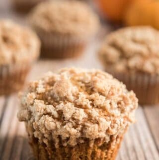 best pumpkin muffin with crumble topping on wood board