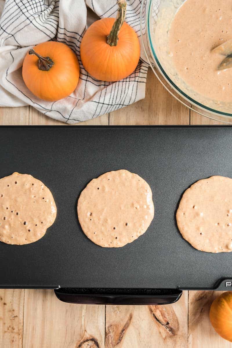 pumpkin pancakes on griddle
