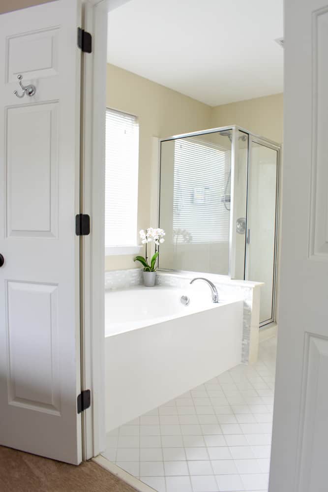 A large bathroom with a soaker tub and walk-in shower