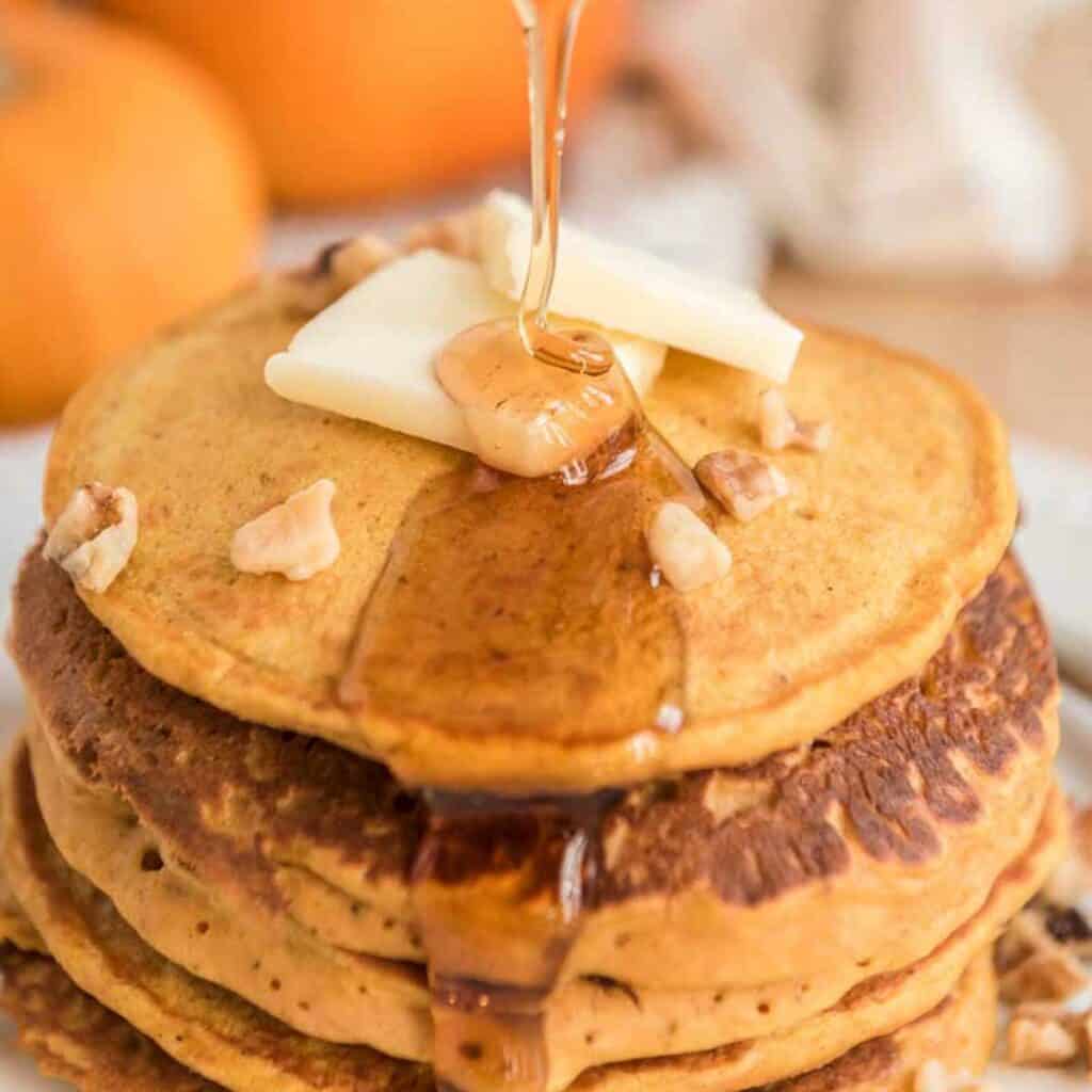 pumpkin pancakes with butter and syrup