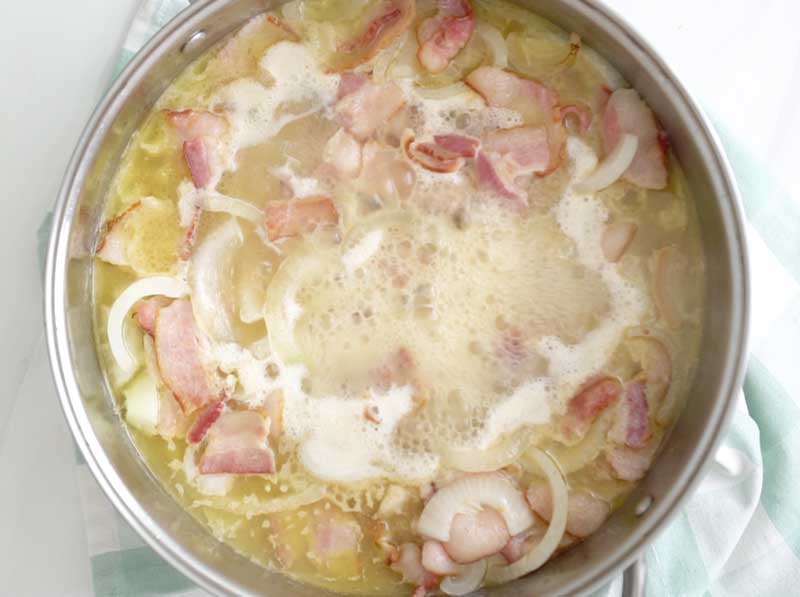 butter bacon and onion simmering in pan