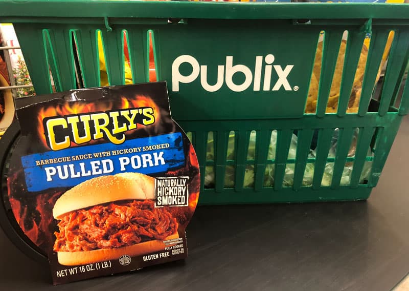 curly's pulled pork container with publix shopping basket