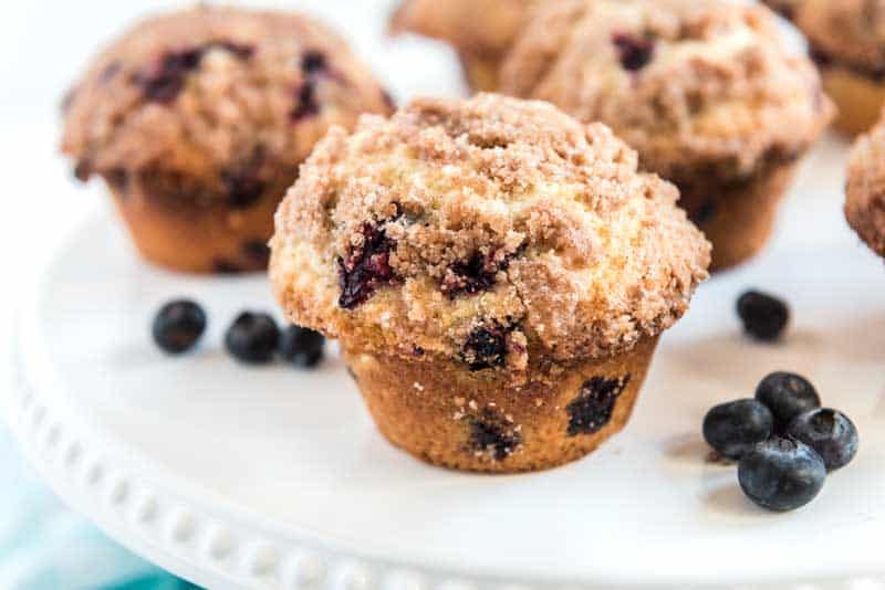 homemade best blueberry muffins on white platter