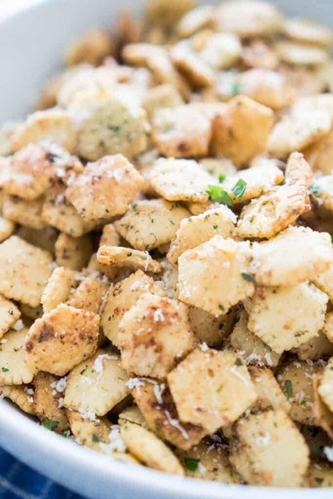 close up of Ranch seasoned oyster crackers in white bowl