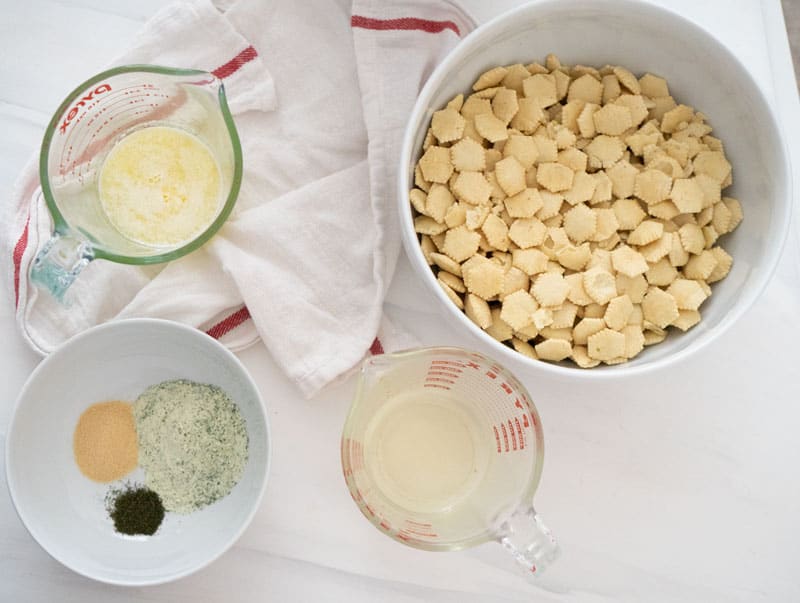 Ranch seasoned oyster cracker ingredients in white bowls