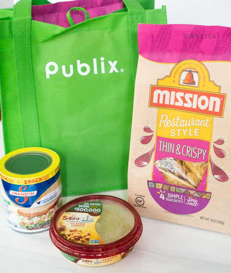 publix bag with canned chicken mission tortilla chips and hummus