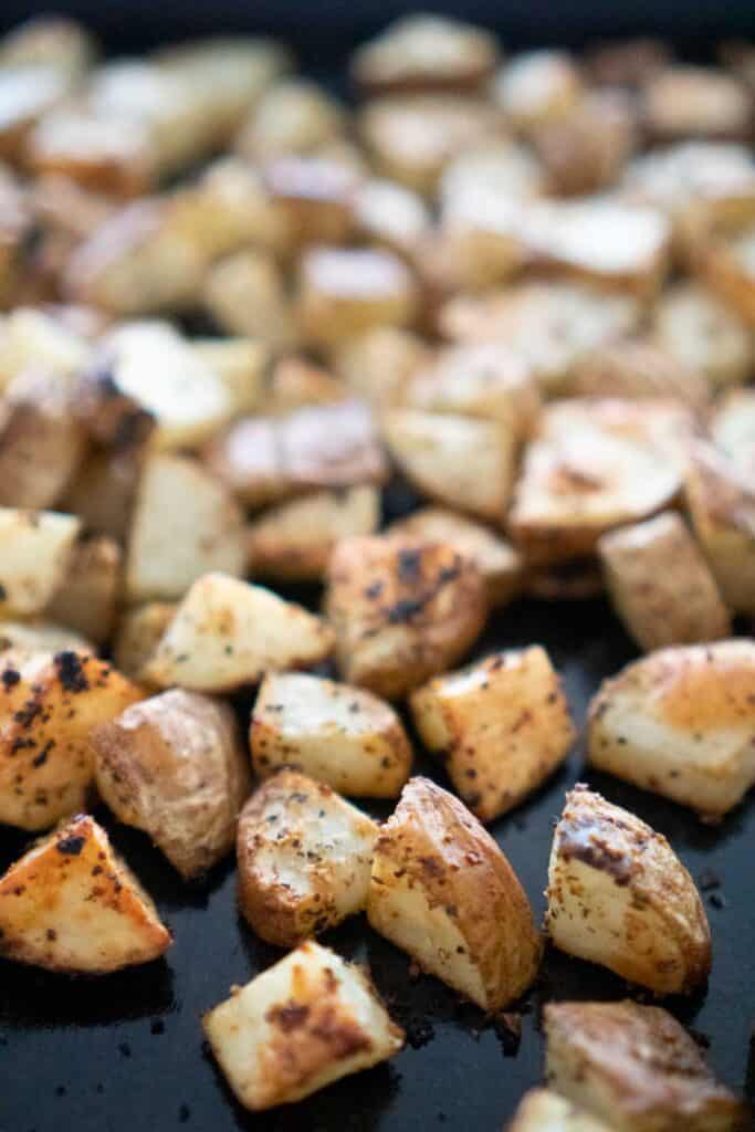 Roasted russet potatoes on baking sheet