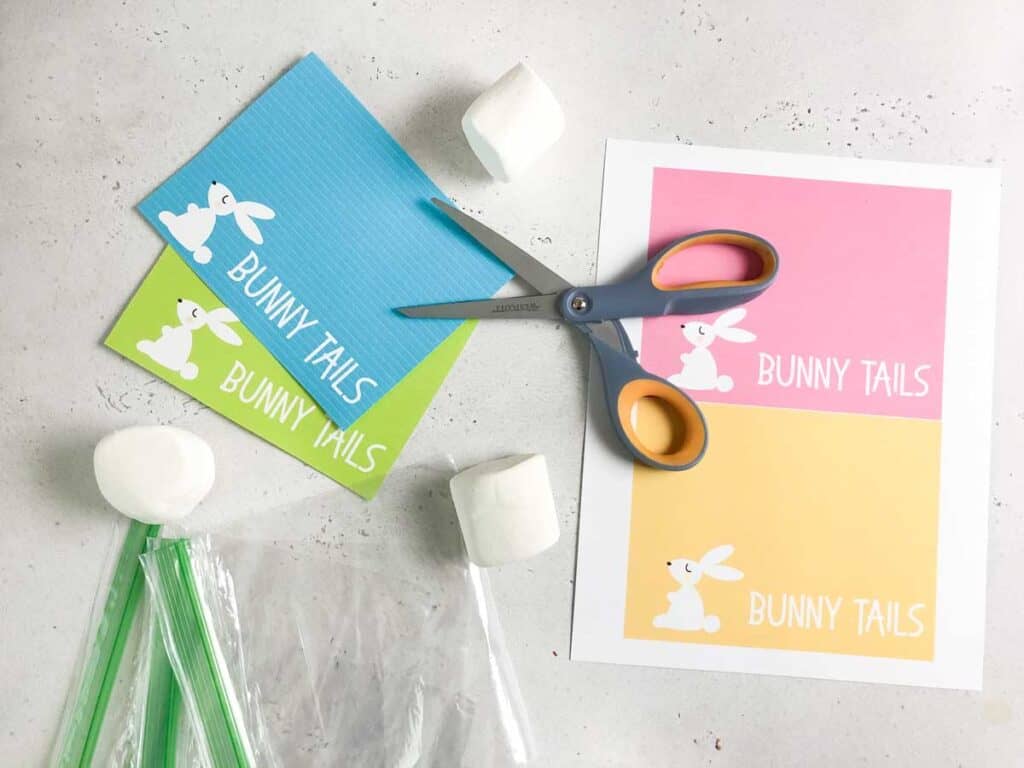 free printable easter bunny tail gift tags cut with scissors and marshmallows and sandwich bags