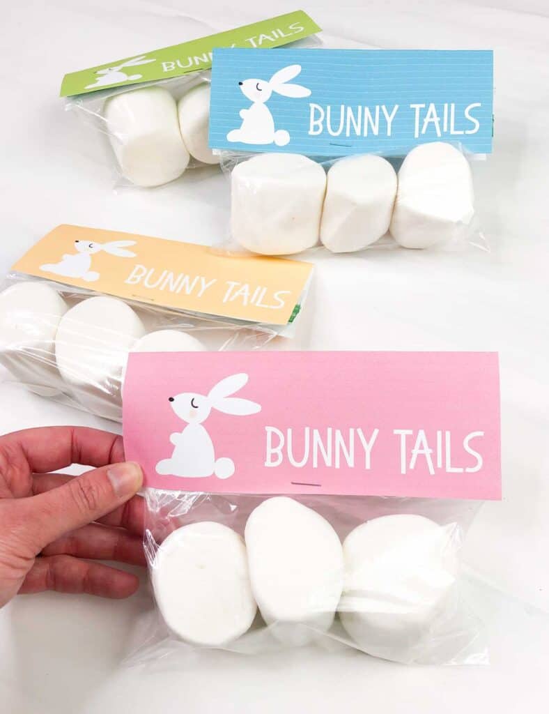 hand holding bag of large marshmallows with easter bunny tail free printable gift tag