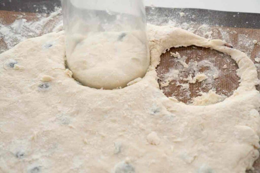 cutting biscuit dough with glass