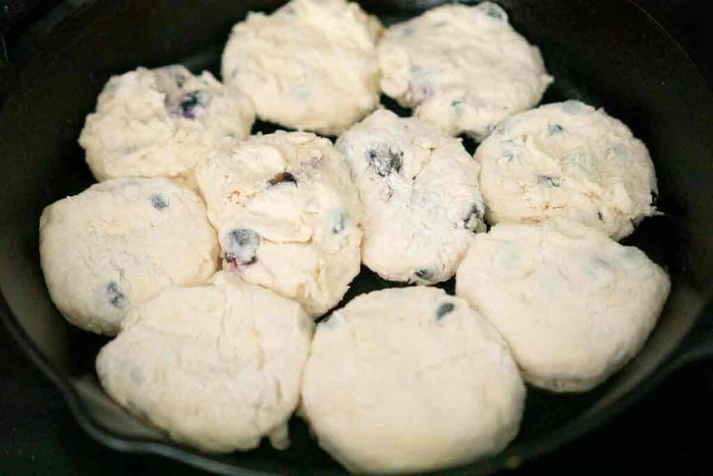blueberry butter milk biscuits in cast iron pan before baking