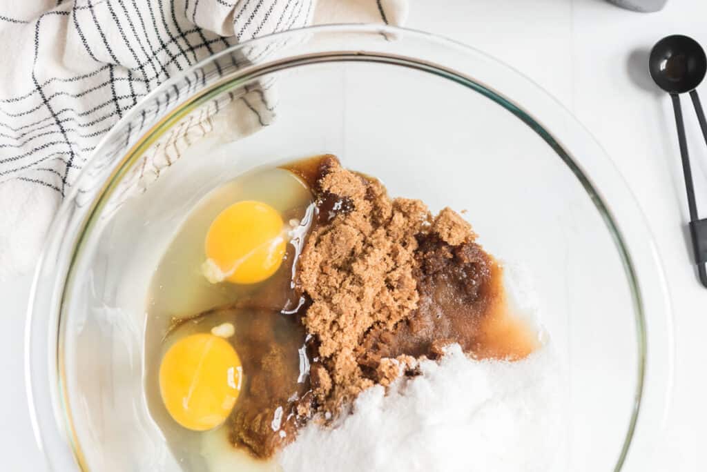 oatmeal raisin cookie ingredients in glass bowl