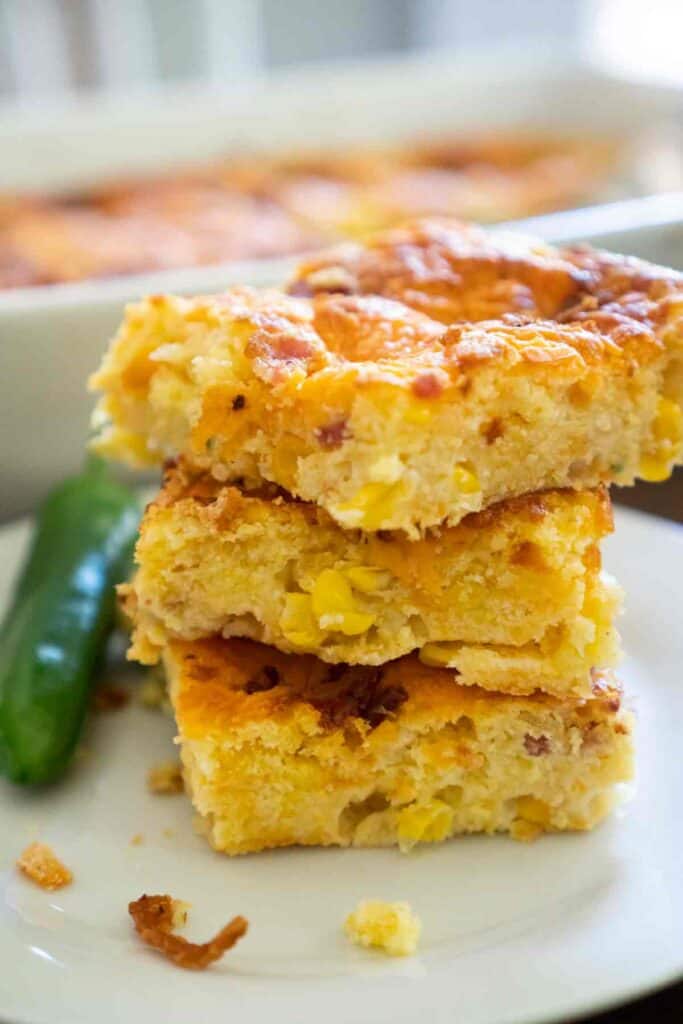 stacked bacon jalapeño cheddar cornbread on white plate