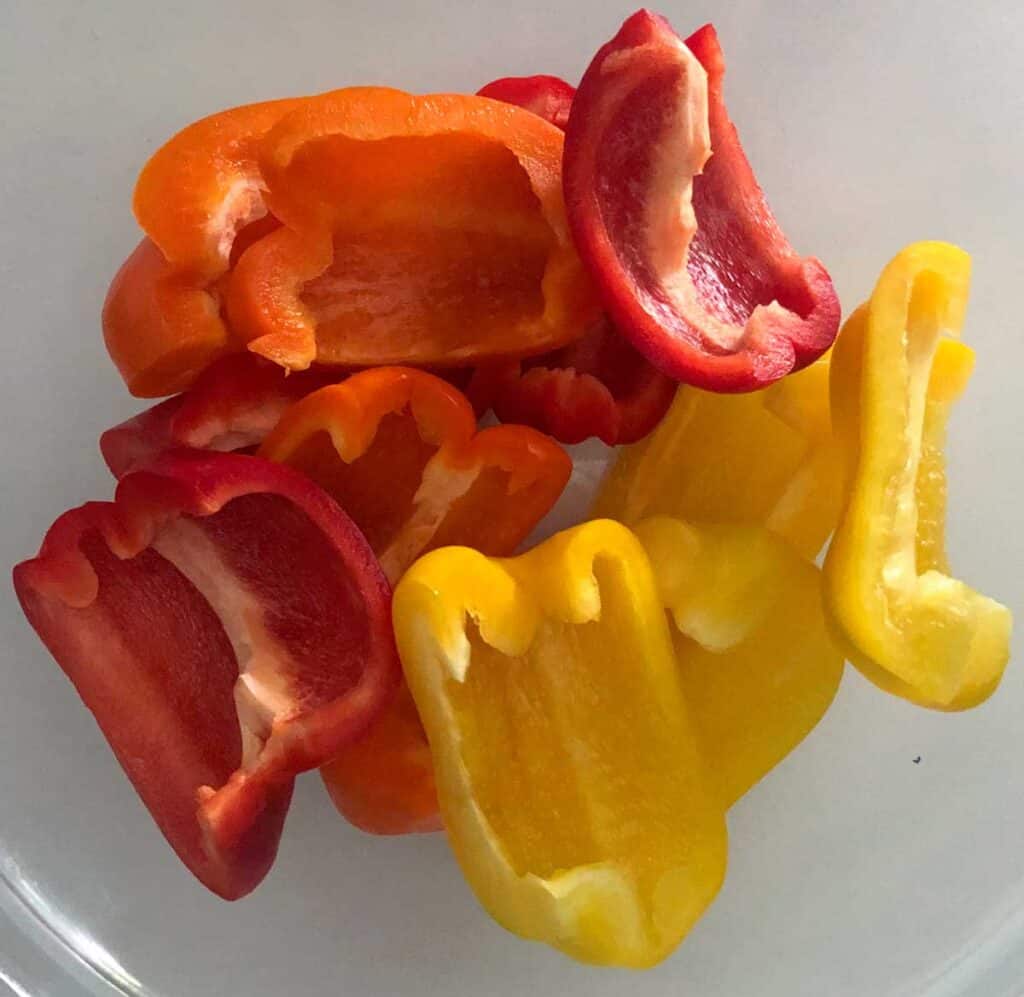 cut bell peppers in a clear glass bowl