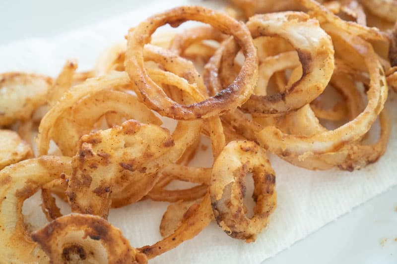 fried onions on white plate