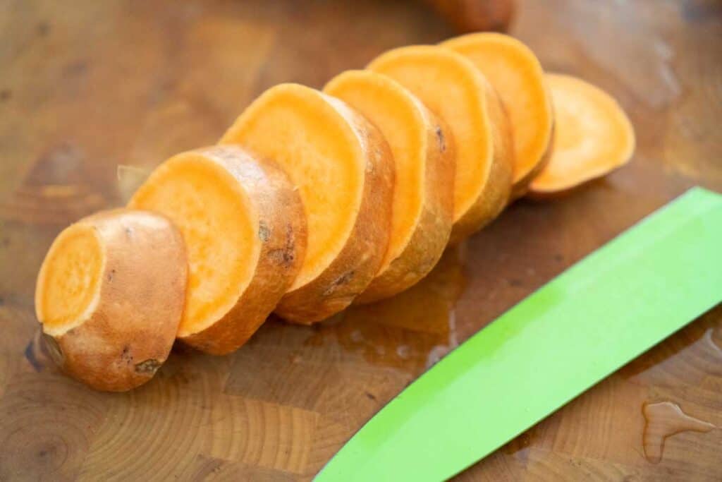 sliced sweet potato on cutting board