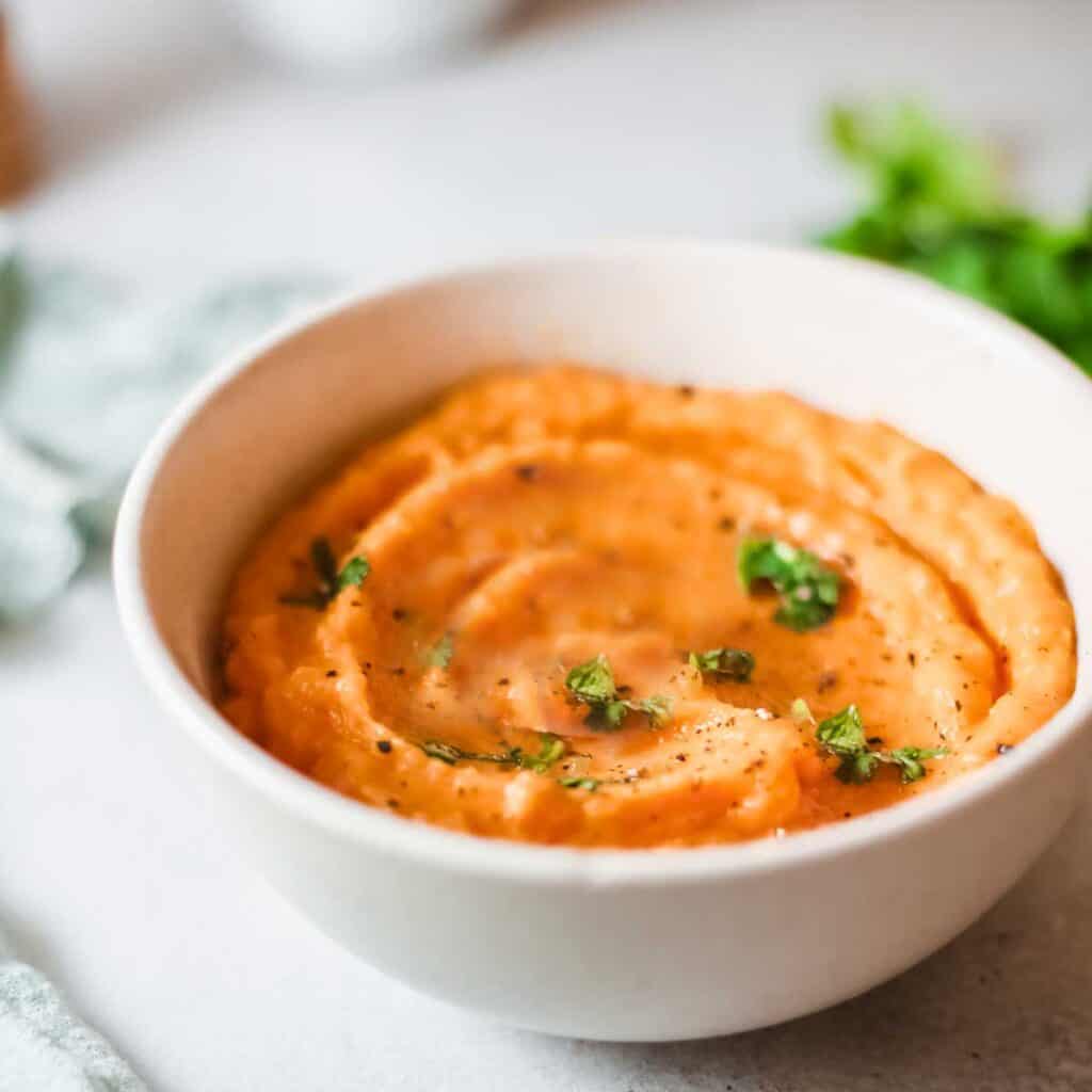 mashed sweet potatoes in white bowl