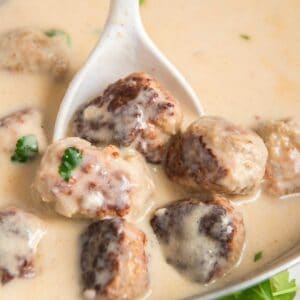white spoon with Swedish meatballs