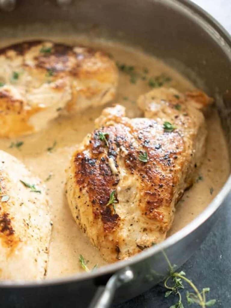 creamy garlic herb chicken in pan