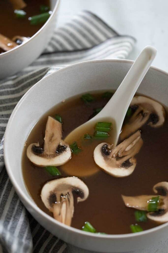 japanese clear soup in white bowl