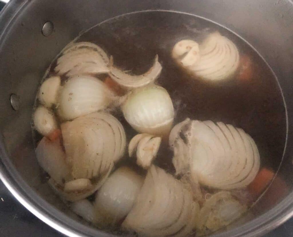 onions in broth in large pot