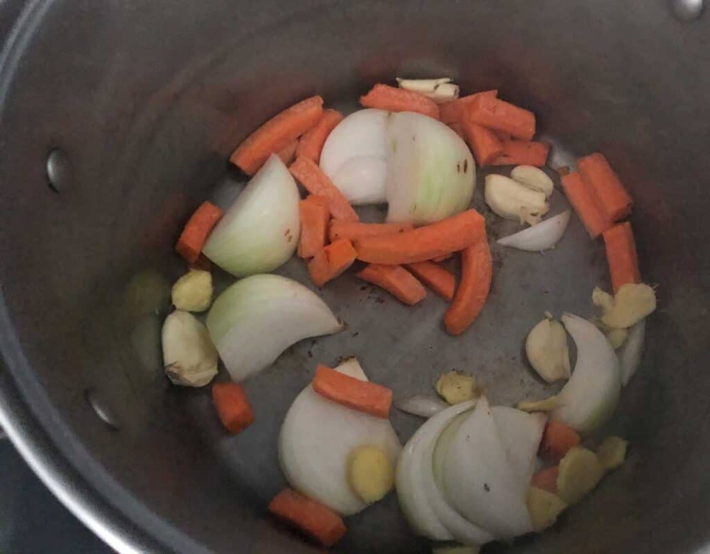 carrots, onion and garlic in large pot