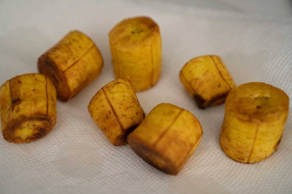 fried plantain slices on paper towel