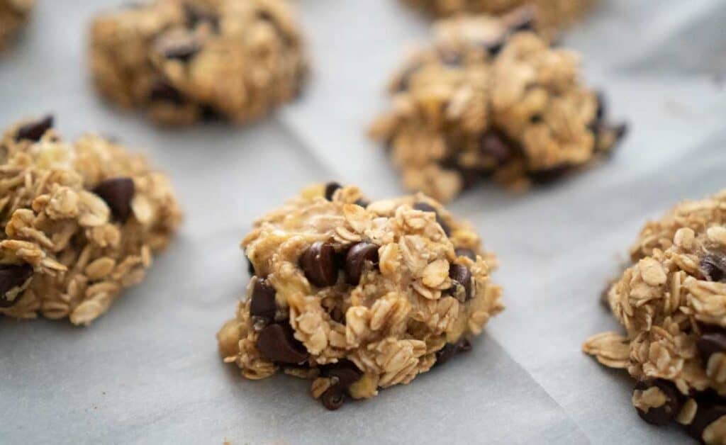 banana oatmeal cookies on baking sheet parchment paper